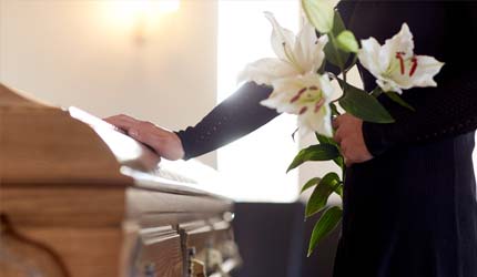 casket with flowers Florida Wrongful Death Law Explained