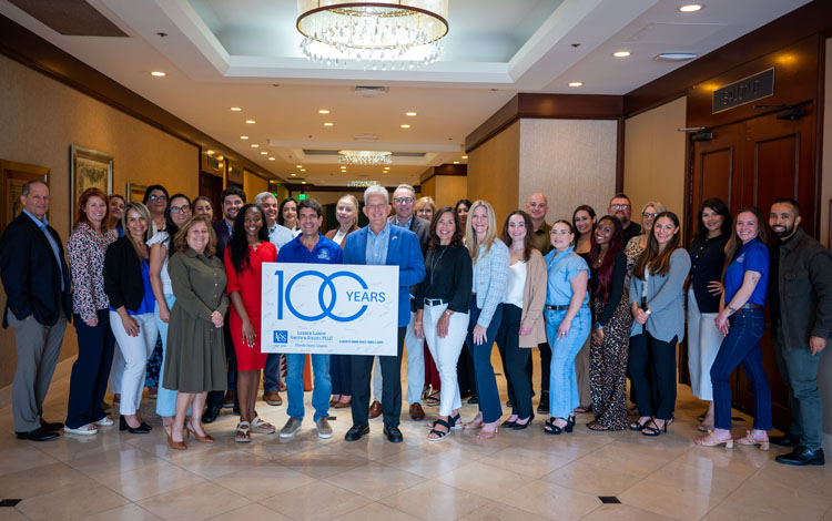 florida personal injury lawyers lesser landy smith siegel group photo 100 years banner 2026