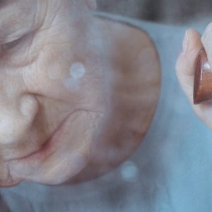 Older woman with dementia crying