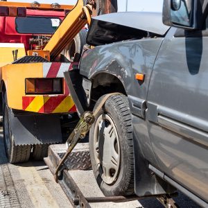 Tow truck towing a broken down car in emergency
