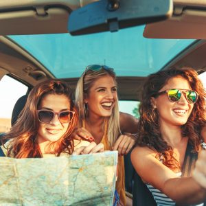 Three female friends enjoying traveling