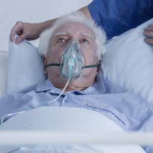 Senior man with oxygen mask