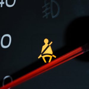 Yellow lit Warning lamp not wearing a seat belt close up