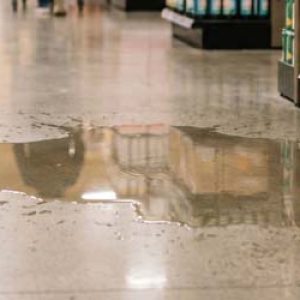 slip and fall hazard in grocery store - pooling water